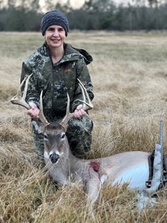 Happy hunter with whitetail